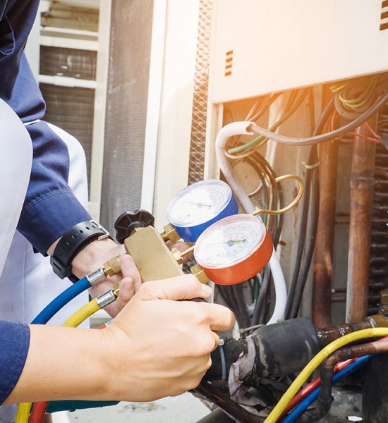 Technician is checking air conditioner